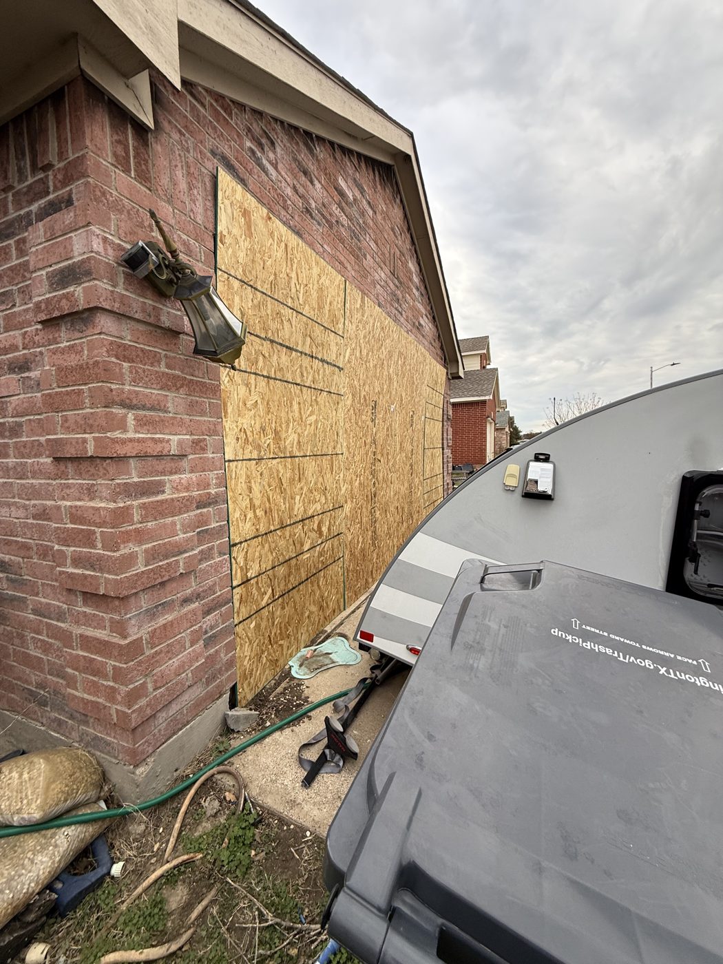 Board-up service securing a damaged property